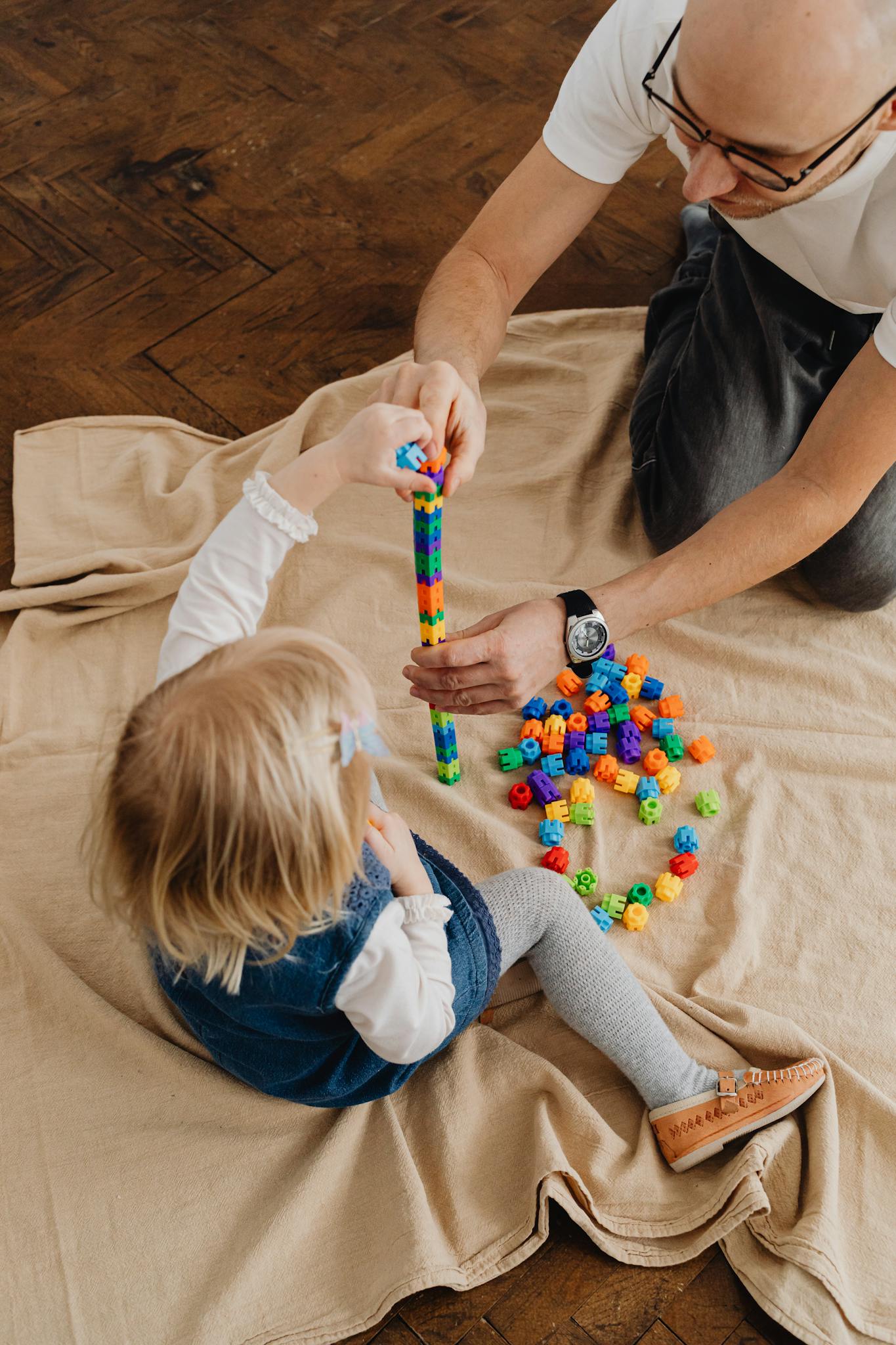 a father and daughter bonding over colorful
