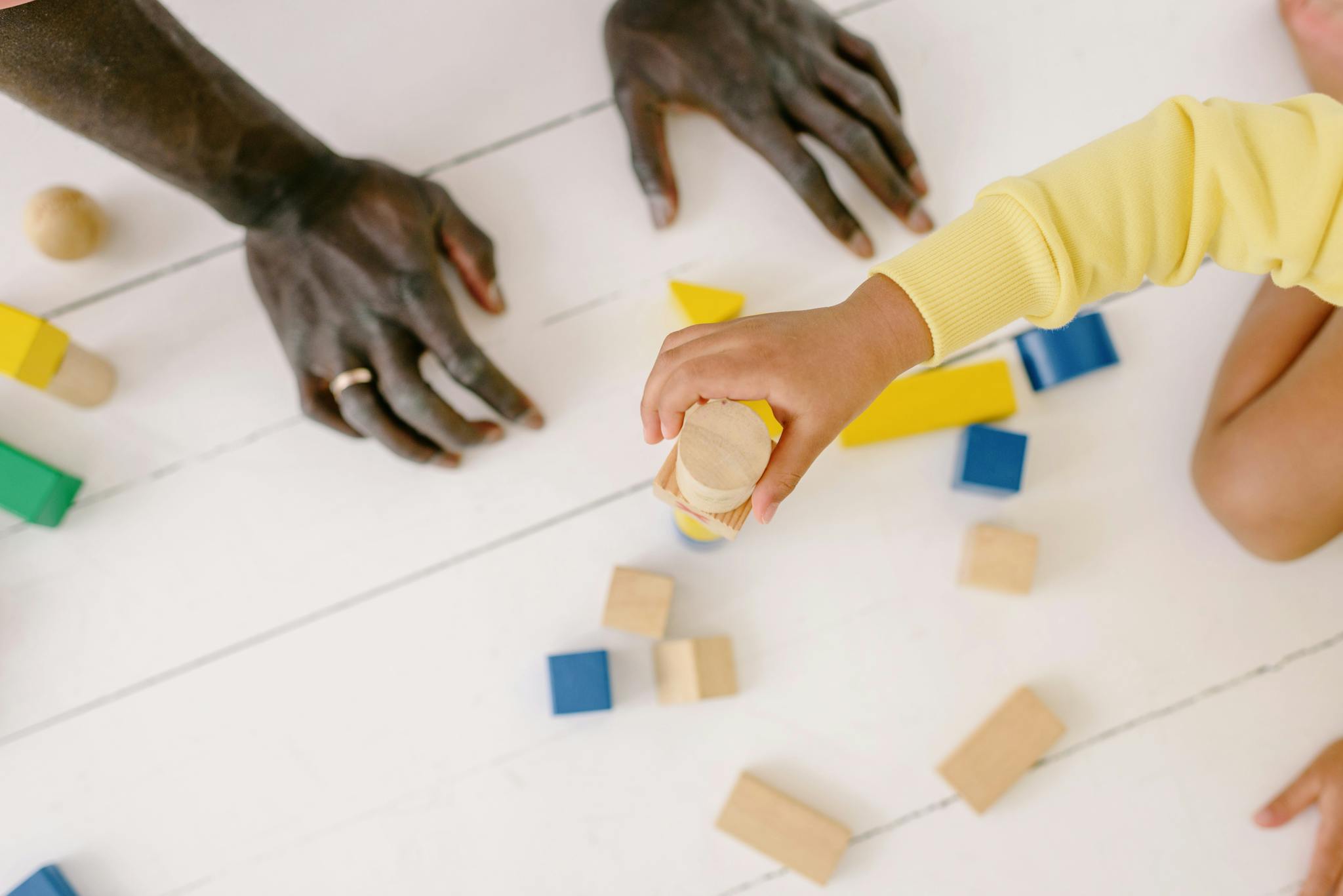 a parent and child playing together with